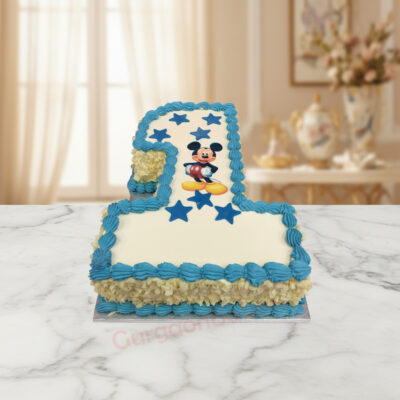 Mickey Mouse themed first birthday cake with blue and yellow decorations