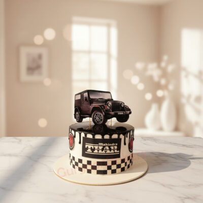 A beautifully designed new car cake featuring a Mahindra Thar on top