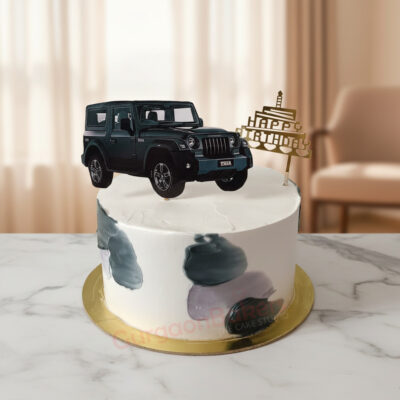New car theme birthday cake with an SUV model on top