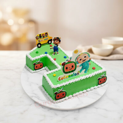 A vibrant Number 1 Cocomelon cake decorated with fun characters and colorful details.