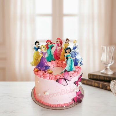 A beautiful pink princess theme cake decorated with princess figurines and butterflies.