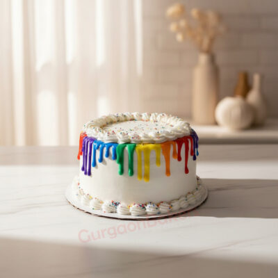 Rainbow theme cake with colorful drizzles and sprinkles