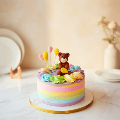 A colorful teddy bear theme cake with balloons and flowers.