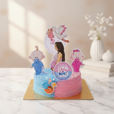Whimsical baby shower cake featuring blue and pink designs with cute baby decorations.