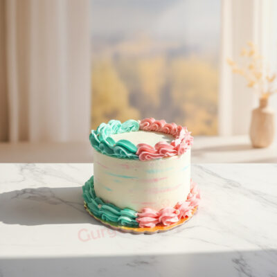 Whimsical baby shower cake with pastel pink and blue frosting