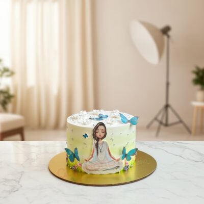 A beautifully designed Yoga theme cake with a meditative figure and butterflies.