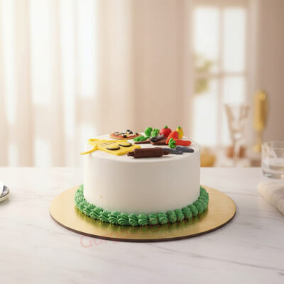 Chef themed cake decorated with kitchen tools and ingredients.