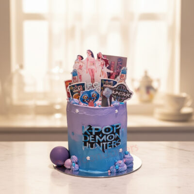 K-Pop Demon Hunters cake with vibrant purple design and character toppers