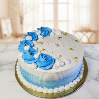 Beautiful blue smash cake with decorative flowers and gold accents