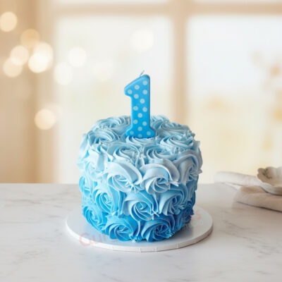 Blue smash cake with a number one candle for a first birthday