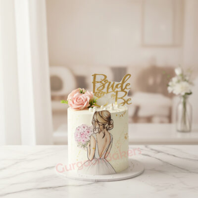 A beautiful 'Bride to Be' themed cake with floral accents