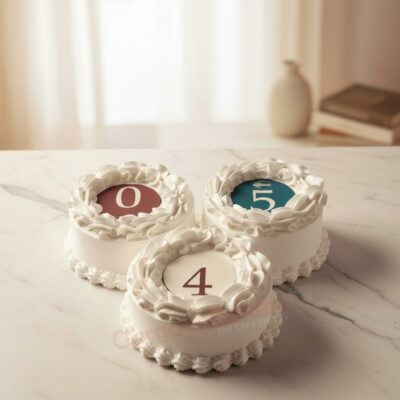 Three elegant corporate cakes featuring numbers 0, 4, and 5 in Gurgaon | Gurgaon Bakers