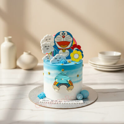 Colorful Doraemon cake design with clouds and rainbow decorations in Gurgaon | Gurgaon Bakers