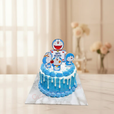 Delicious Doraemon birthday cake with colorful frosting and toppers in Gurgaon | Gurgaon Bakers