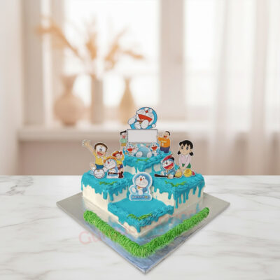 Doraemon themed cake with blue icing and character toppers in Gurgaon | Gurgaon Bakers