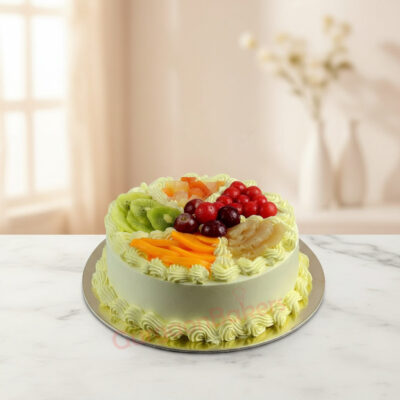 A beautifully decorated healthy fruit cake topped with assorted fruits