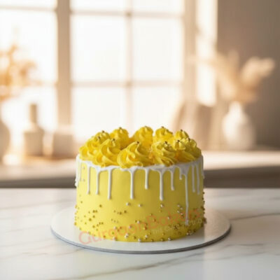 A vibrant lemon cake with yellow frosting and decorative white drips