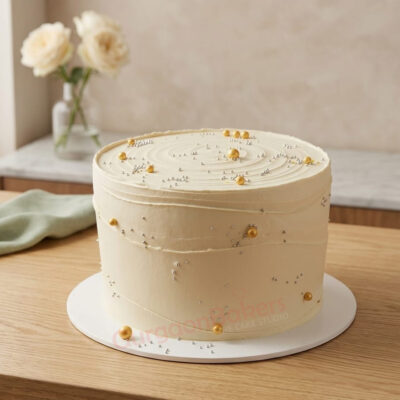 A beautifully designed minimalist cake with smooth buttercream and golden accents in Gurgaon | Gurgaon Bakers