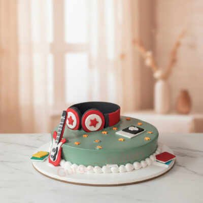 A creative music lover cake featuring headphones and guitar decor in Gurgaon | Gurgaon Bakers