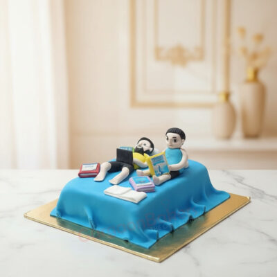 Custom cake design for nerds, featuring two figures reading on a bed in Gurgaon | Gurgaon Bakers