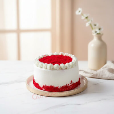 Delicious red velvet cake with creamy frosting and red crumbs