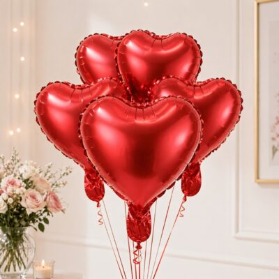 Bundle of red heart shaped foil balloons with red ribbons for romantic anniversary or birthday decoration in Gurgaon