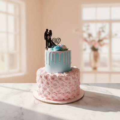 A beautifully designed wedding cake featuring a blue and pink color scheme with floral accents in Gurgaon | Gurgaon Bake