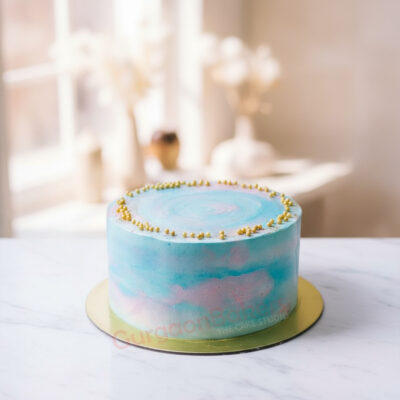 A trendy blue swirl cake adorned with golden accents