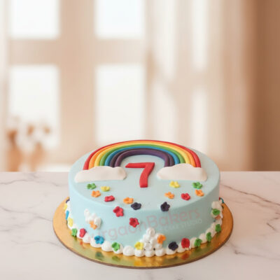 Vibrant rainbow cake design with colorful layers and decorative elements in Gurgaon | Gurgaon Bakers
