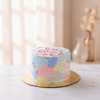 A beautifully decorated pastel cake with soft colors and sprinkles.