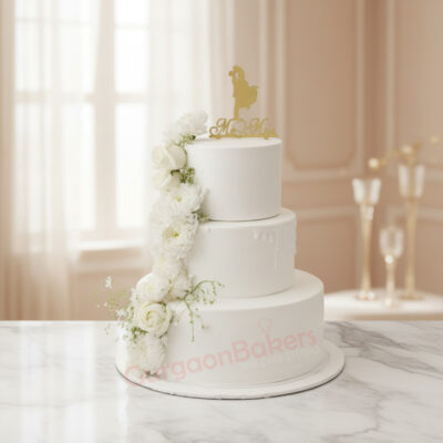 Elegant White Wedding Tier Cake decorated with flowers in Gurgaon | Gurgaon Bakers