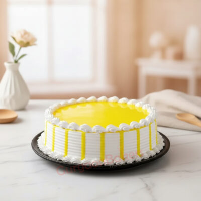 A beautifully decorated lemon healthy cake with white frosting and yellow glaze