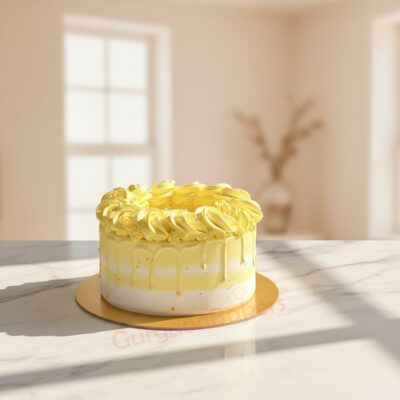 Delicious eggless mango cake with yellow frosting in Gurgaon | Gurgaon Bakers