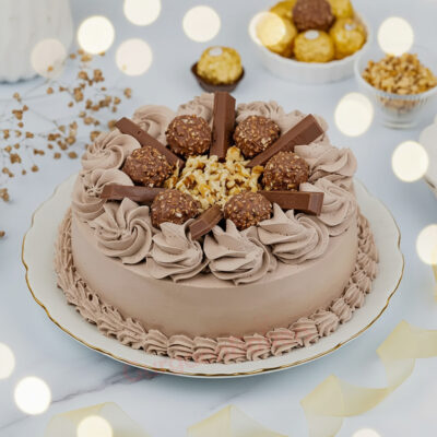 A beautifully decorated Ferrero cake with hazelnut frosting and chocolate toppings in Gurgaon | Gurgaon Bakers
