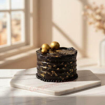 Luxurious Ferrero Rocher cake decorated with gold accents in Gurgaon | Gurgaon Bakers