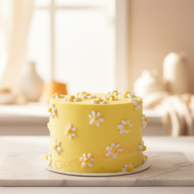 Delicious mango birthday cake decorated with white and yellow flowers in Gurgaon | Gurgaon Bakers