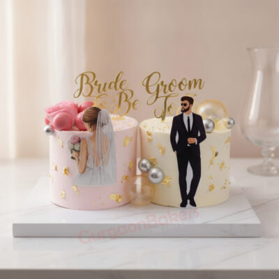 Elegant engagement cake featuring bride and groom figurines in Gurgaon | Gurgaon Bakers