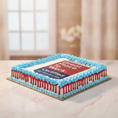 A beautifully crafted company logo cake celebrating Great Place to Work certification with blue and red icing in Gurgaon