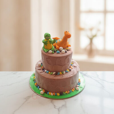 A two-tier dinosaur birthday cake with colorful dinosaur figurines in Gurgaon | Gurgaon Bakers