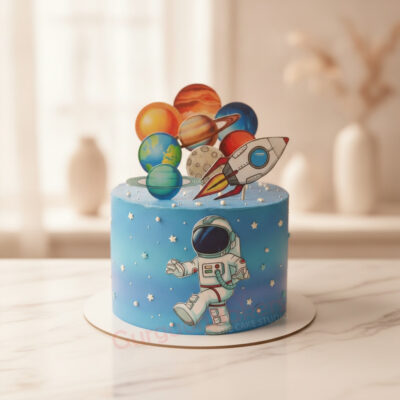 Colorful rocket ship cake with planets for a space-themed celebration in Gurgaon | Gurgaon Bakers