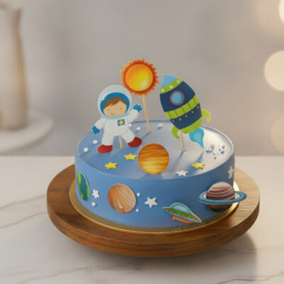 A colorful space theme birthday cake featuring an astronaut, planets, and a rocket in Gurgaon | Gurgaon Bakers