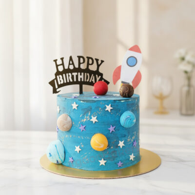 A beautifully crafted space theme cake with planets and a rocket in Gurgaon | Gurgaon Bakers